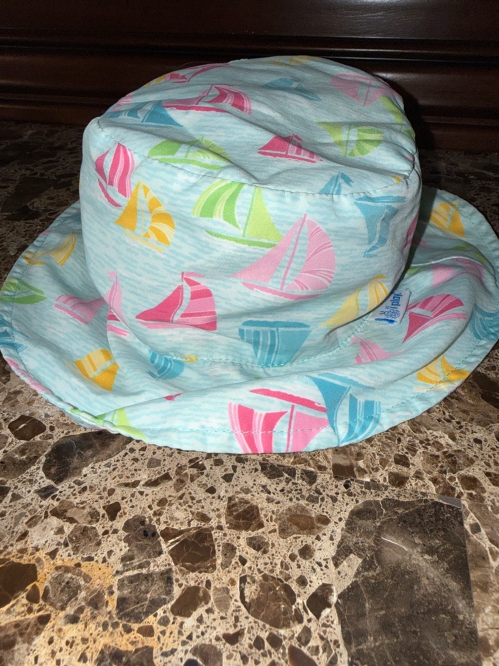 2t-4t adjustable strap swim hat. Blue with sailboats.